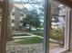 Picturesque view from the window showcasing lush greenery and neighborhood charm at 12450 E Cornell Ave # 101, Aurora, CO 80014