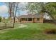 Brick home exterior with covered patio and expansive backyard at 1345 Laredo St, Aurora, CO 80011