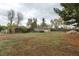 Large fenced backyard with a few sheds at 1345 Laredo St, Aurora, CO 80011