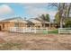 Fenced backyard and brick house at 1345 Laredo St, Aurora, CO 80011