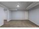 Finished basement with carpeted floors, painted walls, base trim and a basement window at 1345 Laredo St, Aurora, CO 80011