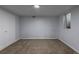 Basement bedroom with carpeted floors, painted walls and a basement window at 1345 Laredo St, Aurora, CO 80011