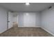 Basement bedroom with carpeted floors, painted walls, trim and doorways to other rooms at 1345 Laredo St, Aurora, CO 80011