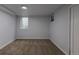 Finished basement featuring neutral carpet, egress window, and ample space for versatile use at 1345 Laredo St, Aurora, CO 80011