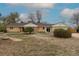Charming single-story brick home with well-maintained landscaping and inviting curb appeal in a quiet neighborhood at 1345 Laredo St, Aurora, CO 80011