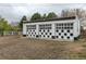 Three-car garage with checkered pattern doors at 1345 Laredo St, Aurora, CO 80011