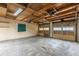 Spacious two-car garage with exposed wood ceiling at 1345 Laredo St, Aurora, CO 80011