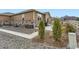 Cozy home backyard with a stone base, rock landscaping, and concrete patio at 6045 High Timber Cir, Castle Rock, CO 80104