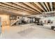 Unfinished basement with exposed beams, high ceilings, and ample storage space at 6045 High Timber Cir, Castle Rock, CO 80104
