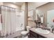 Bright bathroom featuring a shower-tub combo, modern vanity, and tiled floor at 6045 High Timber Cir, Castle Rock, CO 80104