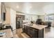 Open kitchen features granite countertops, stainless steel appliances, and a large center island at 6045 High Timber Cir, Castle Rock, CO 80104