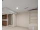 Large basement area with built-in shelves, storage cabinets and a mirrored closet at 3912 S Richfield Way, Aurora, CO 80013