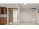 Basement area with built-in cabinets, mirrored closet doors, and an attached bathroom at 3912 S Richfield Way, Aurora, CO 80013