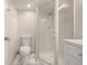 Bathroom featuring a modern shower, toilet and vanity at 3912 S Richfield Way, Aurora, CO 80013