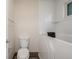 Bathroom featuring a walk-in tub and a standard toilet at 3912 S Richfield Way, Aurora, CO 80013