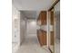Hallway with wood cabinets and a view of a bathroom at 3912 S Richfield Way, Aurora, CO 80013