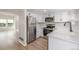 Well-lit kitchen with stainless steel appliances and white cabinetry at 3912 S Richfield Way, Aurora, CO 80013