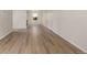 Open living room with pristine floors and ample natural light from a large window at 3912 S Richfield Way, Aurora, CO 80013