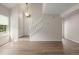 Bright living room featuring hardwood floors, staircase, and neutral paint at 3912 S Richfield Way, Aurora, CO 80013