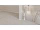 Neutral staircase landing with light fixture at 3912 S Richfield Way, Aurora, CO 80013