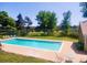 Enjoy community amenities such as the refreshing pool, lounge chairs, and lush landscaping for summer relaxation at 3912 S Richfield Way, Aurora, CO 80013