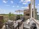 This deck features patio furniture, string lights, and stunning views at 3056 Yale Dr, Broomfield, CO 80023