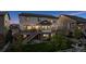 Charming backyard featuring a raised deck with string lights and a well-manicured lawn, great for entertaining at 3056 Yale Dr, Broomfield, CO 80023