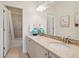 Bathroom with double vanity, granite counters, large mirror and tile floors at 3056 Yale Dr, Broomfield, CO 80023