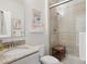 Bathroom featuring a vanity with granite counters, tile accents, and a glass enclosed shower at 3056 Yale Dr, Broomfield, CO 80023