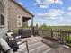 Outdoor deck with a barbecue, seating area and a scenic view at 3056 Yale Dr, Broomfield, CO 80023