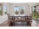 Inviting dining room with natural light, wood floors, and a large table for Gathering gatherings and entertaining at 3056 Yale Dr, Broomfield, CO 80023