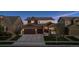 Charming two-story home featuring stone accents, a two-car garage, and a well-manicured lawn at 3056 Yale Dr, Broomfield, CO 80023