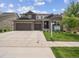 Charming two-story home with a three car garage and well-maintained lawn at 3056 Yale Dr, Broomfield, CO 80023