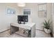 Bright home office with a large desk, stylish decor, and a calming color scheme, perfect for productivity at 3056 Yale Dr, Broomfield, CO 80023