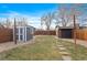 Spacious backyard with shed, patio, and grassy area at 3633 N Cook St, Denver, CO 80205