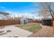 Large backyard with shed, patio, and grassy area at 3633 N Cook St, Denver, CO 80205