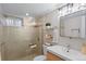 Updated bathroom with glass shower, modern vanity, and stylish fixtures at 3633 N Cook St, Denver, CO 80205