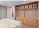 Basement bedroom with built-in drawers and shelving at 3633 N Cook St, Denver, CO 80205