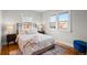 Bright bedroom with hardwood floors and a comfortable bed at 3633 N Cook St, Denver, CO 80205