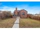 Brick house with a well-maintained lawn and walkway at 3633 N Cook St, Denver, CO 80205