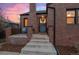 Brick steps leading to a charming front door with a wreath at 3633 N Cook St, Denver, CO 80205