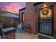 Inviting front porch with brick flooring and seating area at 3633 N Cook St, Denver, CO 80205