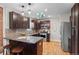 Modern kitchen with dark cabinetry and granite countertops at 3633 N Cook St, Denver, CO 80205