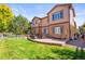 Nice backyard featuring a well-maintained lawn and a stone patio, perfect for outdoor entertaining at 6135 S Paris St, Englewood, CO 80111