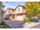 Charming two-story home with a well-manicured lawn and an attached garage at 6135 S Paris St, Englewood, CO 80111