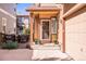 Inviting front porch with a charming entrance and beautiful landscaping at 6135 S Paris St, Englewood, CO 80111