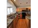 Traditional kitchen with wood cabinets, laminate counters, and black appliances at 10638 Cherrybrook Cir, Highlands Ranch, CO 80126