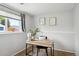 Bright office space featuring neutral walls, modern desk, and a window offering natural light at 9740 W 104Th Dr, Westminster, CO 80021
