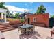 Brick patio, dining area, and detached garage in backyard at 5022 E 17Th Ave, Denver, CO 80220