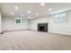 Spacious unfinished basement with fireplace and large windows at 5022 E 17Th Ave, Denver, CO 80220